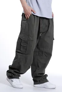 Side view of men's loose fit baggy cargo pants in olive green hip hop style detail