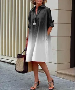 Chic women's black and white gradient loose-fit shirt dress styled on a model outdoors