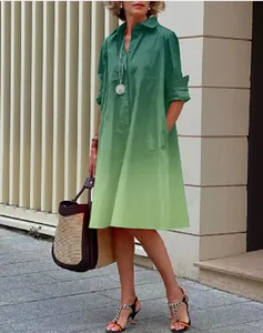 Full length view of a minimalist gradient green long sleeve loose shirt dress