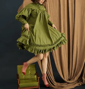 Full view of the green Victorian style ruffled mini dress with puffy long sleeves