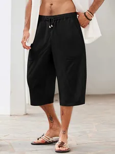 Macro view of black men's cotton linen shorts with pocket and drawstring details