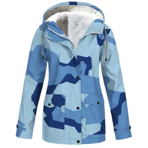 Close-up of a blue camouflage hooded outdoor jacket with a soft white fleece lining detail