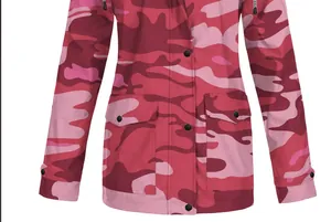 Detailed view of the pink camouflage pattern on a waterproof hooded outdoor jacket