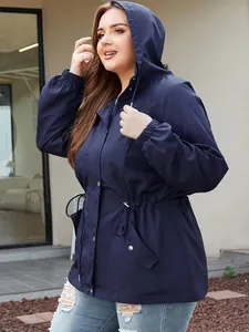 Side view of navy blue hooded waterproof outdoor jacket for women with drawstring waist