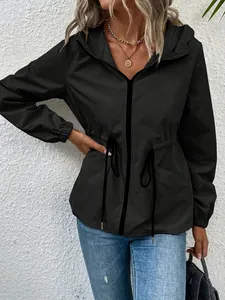 Detail of a black women's waterproof hooded windbreaker jacket with drawstring waist