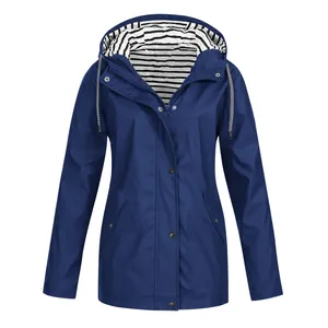 Detailed view of a waterproof blue outdoor windbreaker jacket with striped hood lining