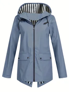 Detail of women's lightweight hooded windbreaker jacket with striped lining in blue