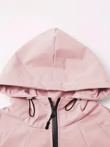 Close-up detail showing the hood and neckline of a pink outdoor windproof jacket