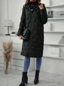Detailed view of women's long black quilted hooded jacket with front zipper closure