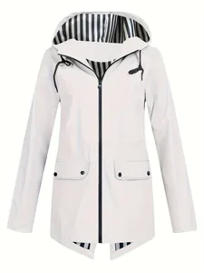 Detail showing the lightweight white hooded windbreaker jacket with striped lining