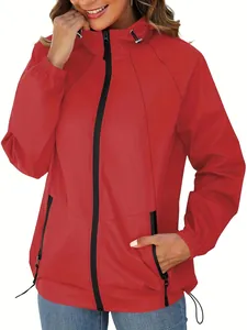 Close-up showing the zipper and hood detail of a red outdoor jacket for women
