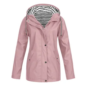 Close-up detail of a pink waterproof outdoor mountaineering jacket with hooded striped lining