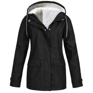 Close-up view of women's black hooded outdoor jacket with white fleece lining details