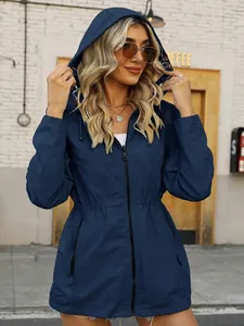 Women's slim-fit hooded windbreaker in navy blue, detailed view of waterproof fabric