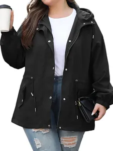 Detail of black women's waterproof outdoor jacket with hood and drawstring waist