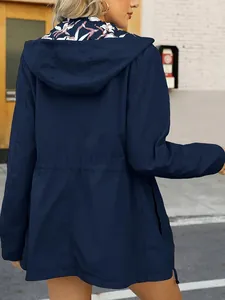 Back view of a navy blue women's slim-fit waterproof windbreaker with drawstring waist