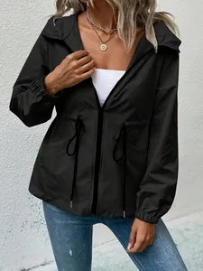 Detailed view of black waterproof hooded windbreaker with adjustable drawstring waist