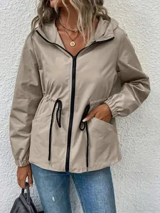 Detailed view of a khaki waterproof hiking jacket with a hooded collar and drawstring waist.