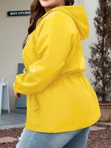 Close-up of women's yellow hooded waterproof jacket with adjustable drawstring waist