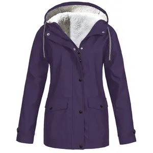 Close-up of women's purple winter hooded jacket featuring a warm white fleece lining.