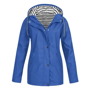 Detailed view of women's blue outdoor waterproof jacket featuring a striped hood lining