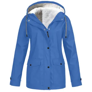 Detail of blue hooded jacket with soft white fleece lining for outdoor wear.