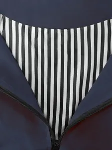 Women's lightweight outdoor windbreaker with black and white striped lining detail