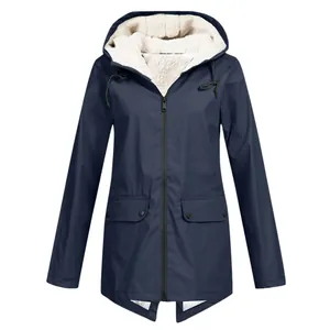 Detail showing the white sherpa fleece lining and hood of this navy blue outdoor jacket