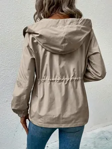 Back view of a khaki hooded waterproof outdoor jacket with drawstring waist detail.