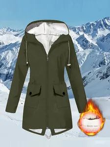 Women's waterproof outdoor hiking jacket with warm fleece lining in snowy mountain scene