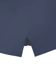 Detailed view of women's lightweight blue windbreaker jacket hem featuring a zipper