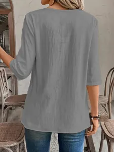 Back view of a grey women's casual linen-texture blouse featuring three-quarter length sleeves
