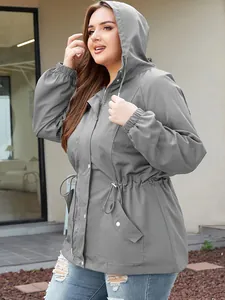 Side view of women's grey hooded waterproof jacket with adjustable waist drawstring
