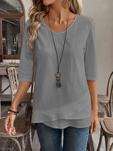 Detailed view of women's gray casual shirt with unique double-layered hem design