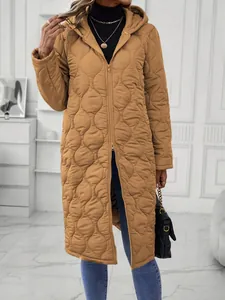Detailed macro view of a women's camel-colored long hooded quilted jacket with double zipper