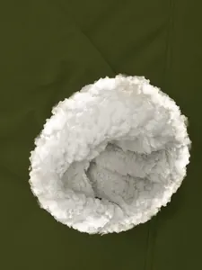 Close-up of soft white Sherpa fleece lining on an olive green waterproof hiking jacket