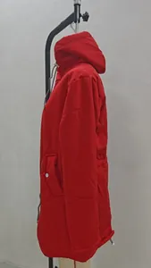 Side view detail of a vibrant red outdoor hooded jacket with functional pockets