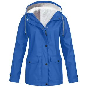 Detailed view of women's blue outdoor hooded jacket with warm white fleece lining and pockets