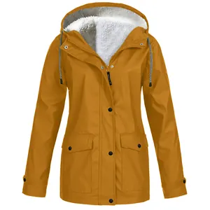 Detailed close-up view of a mustard yellow fleece-lined hooded outdoor windbreaker jacket