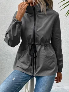 Close-up of waterproof hooded hiking jacket with adjustable waist drawstring
