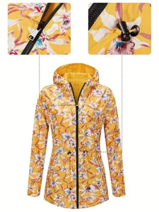 Close-up detail of zipper and adjustable drawstring on yellow floral waterproof jacket
