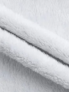 Macro view of the soft white plush fleece lining for outdoor waterproof mountaineering jacket