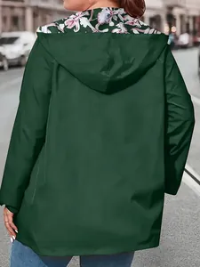 Back view detail of lightweight green outdoor windbreaker with floral hood lining.