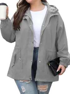 Detailed view of women's grey outdoor waterproof jacket with hood and pockets