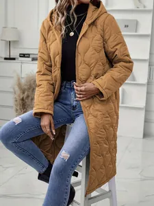 Close-up of a women's long hooded quilted casual jacket in warm caramel brown showing texture.