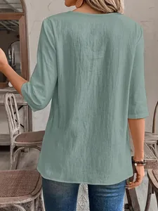 Macro view of sage green textured casual blouse showing back fit and fabric details
