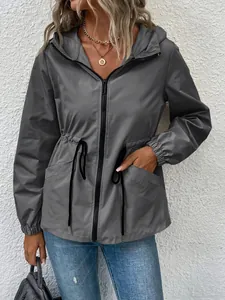 Women's grey waterproof outdoor jacket with adjustable drawstring waist and hood detail