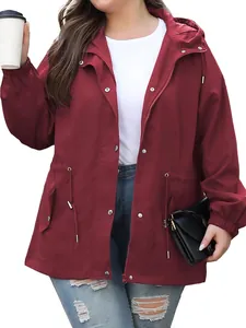Detail of women's burgundy waterproof windbreaker with adjustable hood and drawstring waist