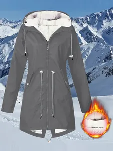 Detailed view of women's grey fleece-lined hooded jacket for outdoor hiking and warmth