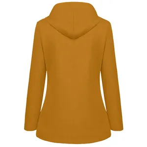 Detailed back view of a mustard yellow hooded outdoor jacket for women's autumn hiking